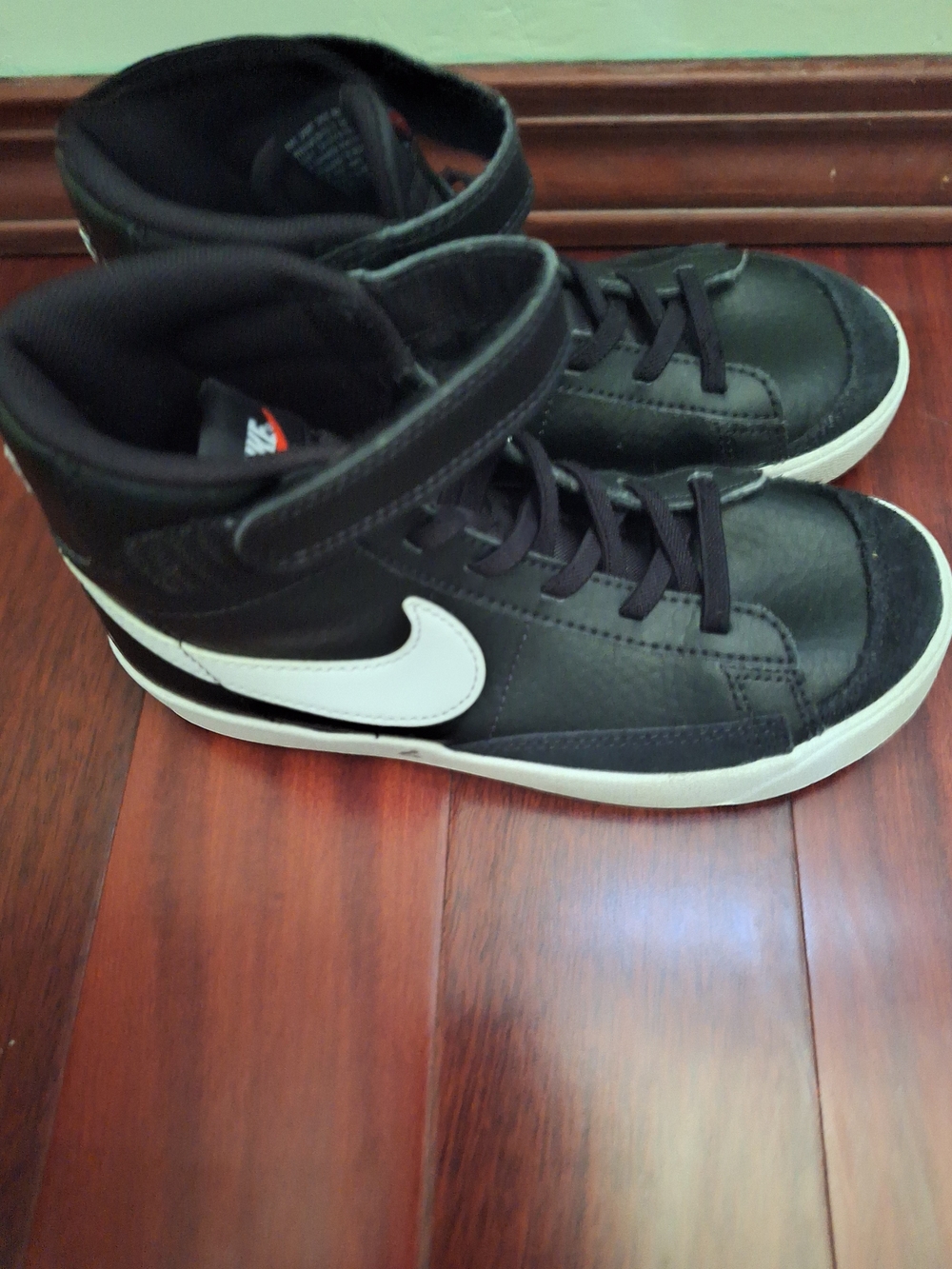 Nike Men’s Black High-Top Sneakers with White Swoosh